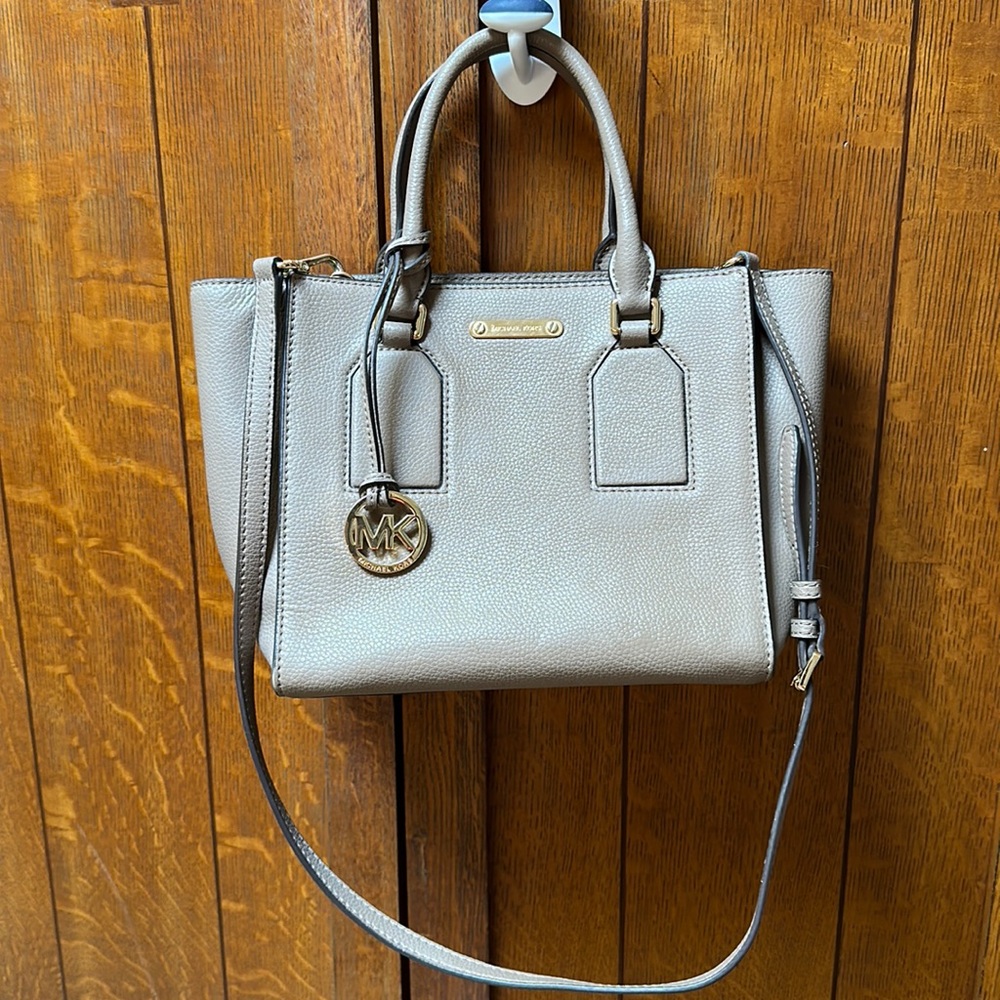 Tan Michael Kors leather tote bag with gold accents